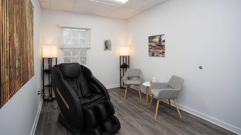 Massage and relaxation room at Rolling Hills Recovery Center with massage chair, soft lighting, and cozy seating.